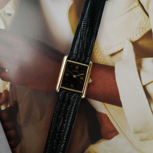 Café noir les montres Cartier Must Tank grand modèle noir 1990