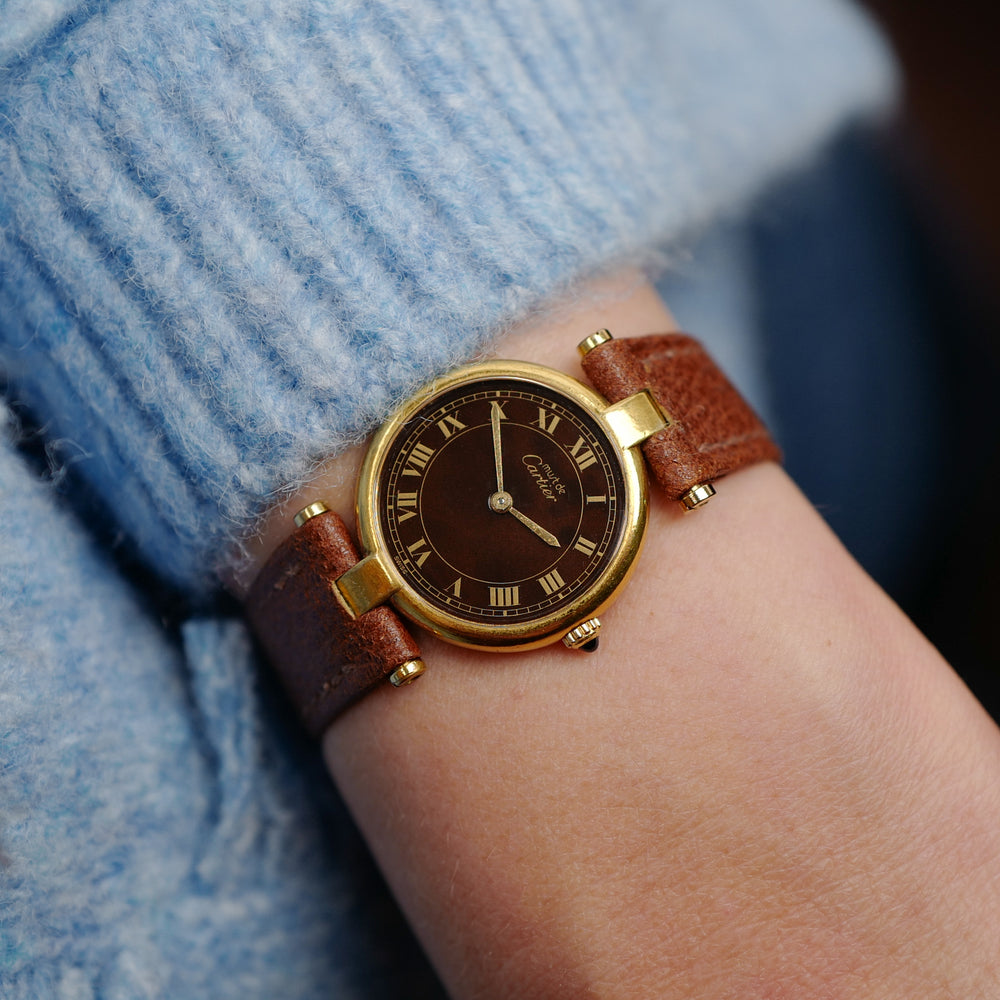 cafe noir les montres vintage horloger marseille CARTIER Vendôme Must ronde Grand Modèle Doré vintage petit modèle ronde patine marron