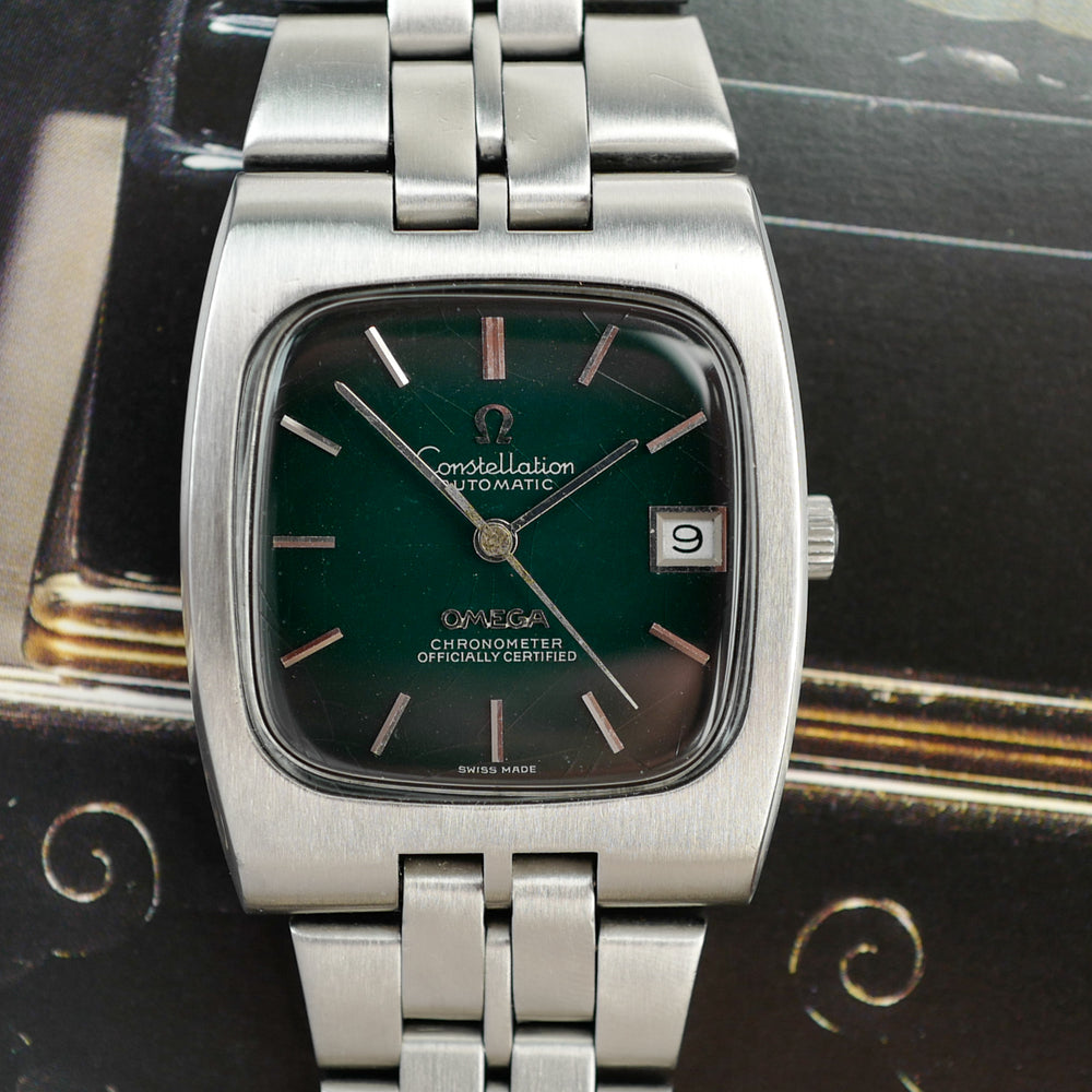 Café noir montre vintage Marseille horloger Omega Constellation green spider dial 168 047