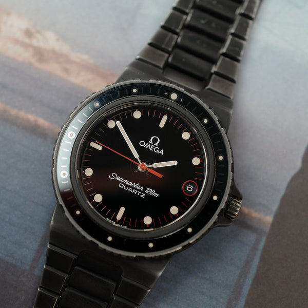 Café noir montre vintage Marseille horloger Omega Seamaster 120 quartz Nimitz PVD 1980