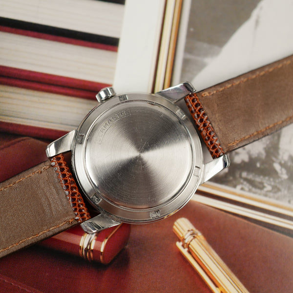 Café noir montre vintage Marseille horloger Omega Seamaster bumper 1954 acier automatique