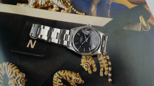 Café noir montre vintage Marseille horloger Rolex Oyster Perpetual date 1500 cadran noir 1962