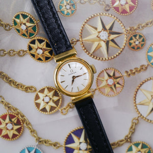 Café noir montres horloger Marseille Omega mini dorée mécanique 1960