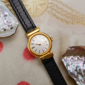 Café noir montres horloger Marseille Omega mini dorée mécanique 1960