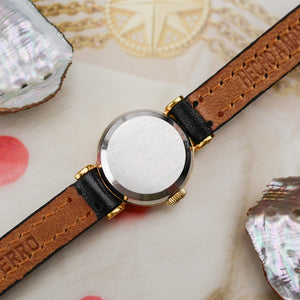Café noir montres horloger Marseille Omega mini dorée mécanique 1960