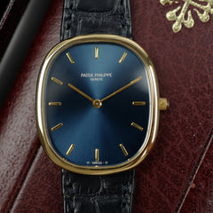 Café noir montres Marseille Patek Philippe Ellipse 3738 cadran bleu 1991 papiers boîte