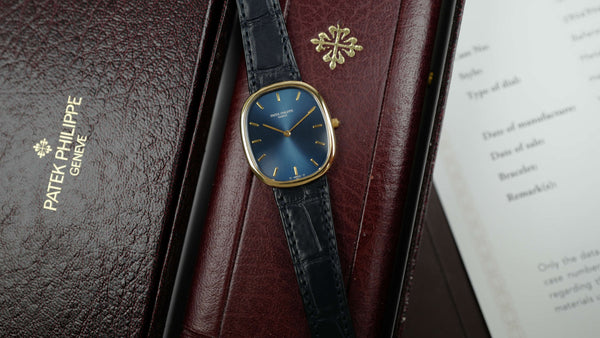 Café noir montres Marseille Patek Philippe Ellipse 3738 cadran bleu 1991 papiers boîte