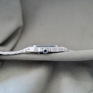 Cartier Santos vintage homme acier cabochon bleu cadran blanc