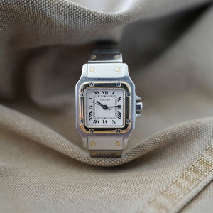 Jolie montre Cartier femme ancienne Santos Tank or
