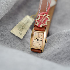 Jolie montre double-tour pour femme plaquée or neuve de stock