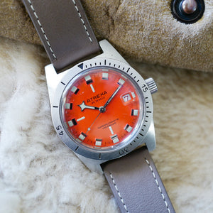 Magnifique montre ancienne skin diver orange