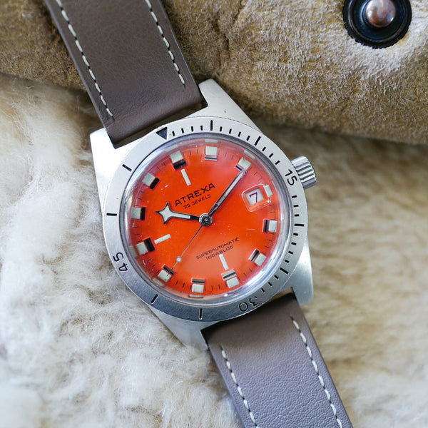 Magnifique montre ancienne skin diver orange