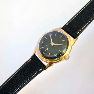 Montre ancienne plaquée or fond noir