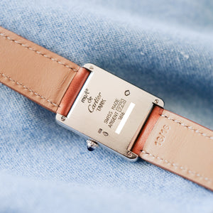 Montre Cartier Tank argent acier bracelet marron vintage
