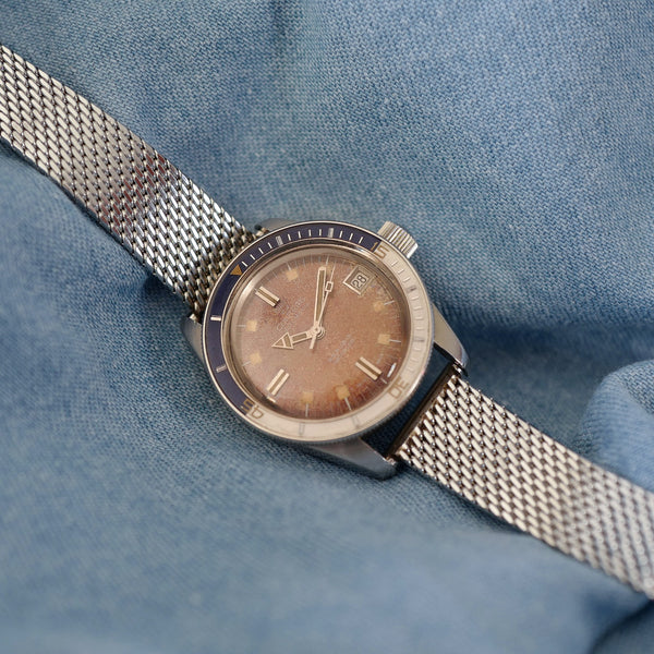 Montre de plongée patine brune lunette bakélite