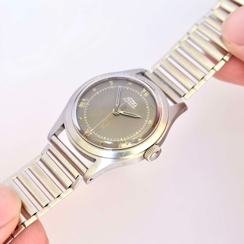 Montre histoire horlogerie vintage cadeau collection bumper acier