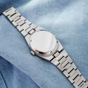 Montre Omega bracelet integré vintage