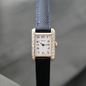 Montre Omega femme tank or et diamants