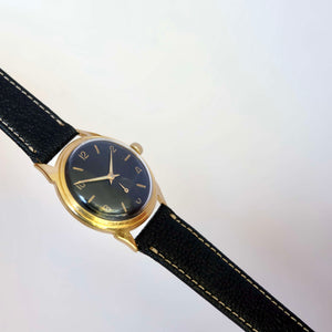 Montre ronde vintage cadran noir