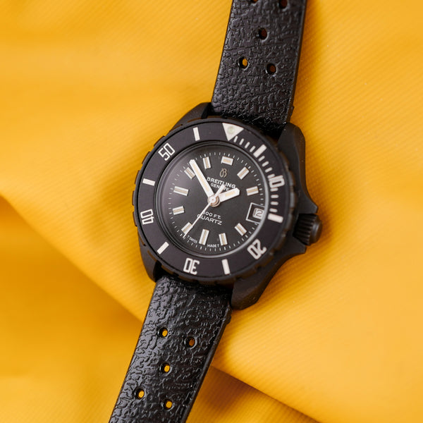 Montre vintage Breitling ancienne PVD noire