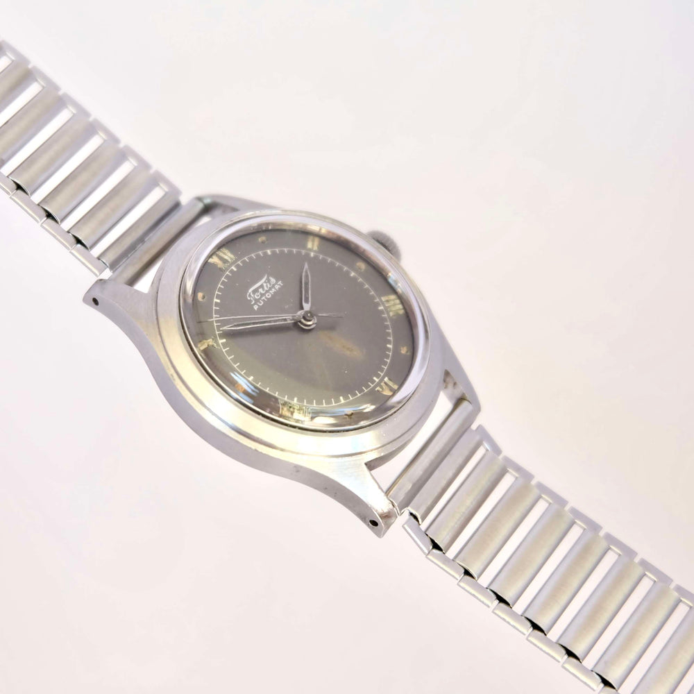 Montre histoire horlogerie vintage cadeau collection bumper acier