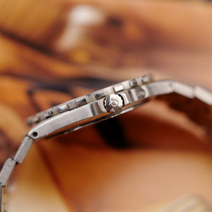 Profil et couronne signée OMEGA