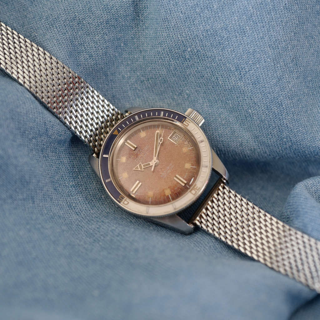 Montre de plongée patine brune lunette bakélite Montre de plongée patine brune lunette bakélite