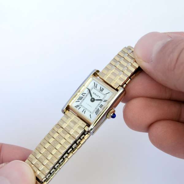 Montre Cartier Tank dorée bracelet doré