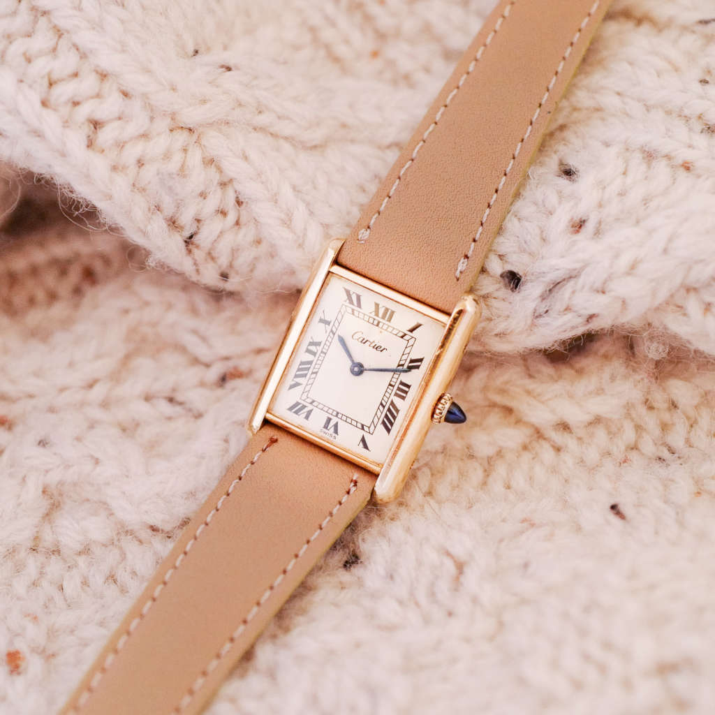 Jolie montre femme homme Cartier Tank grand modele doré