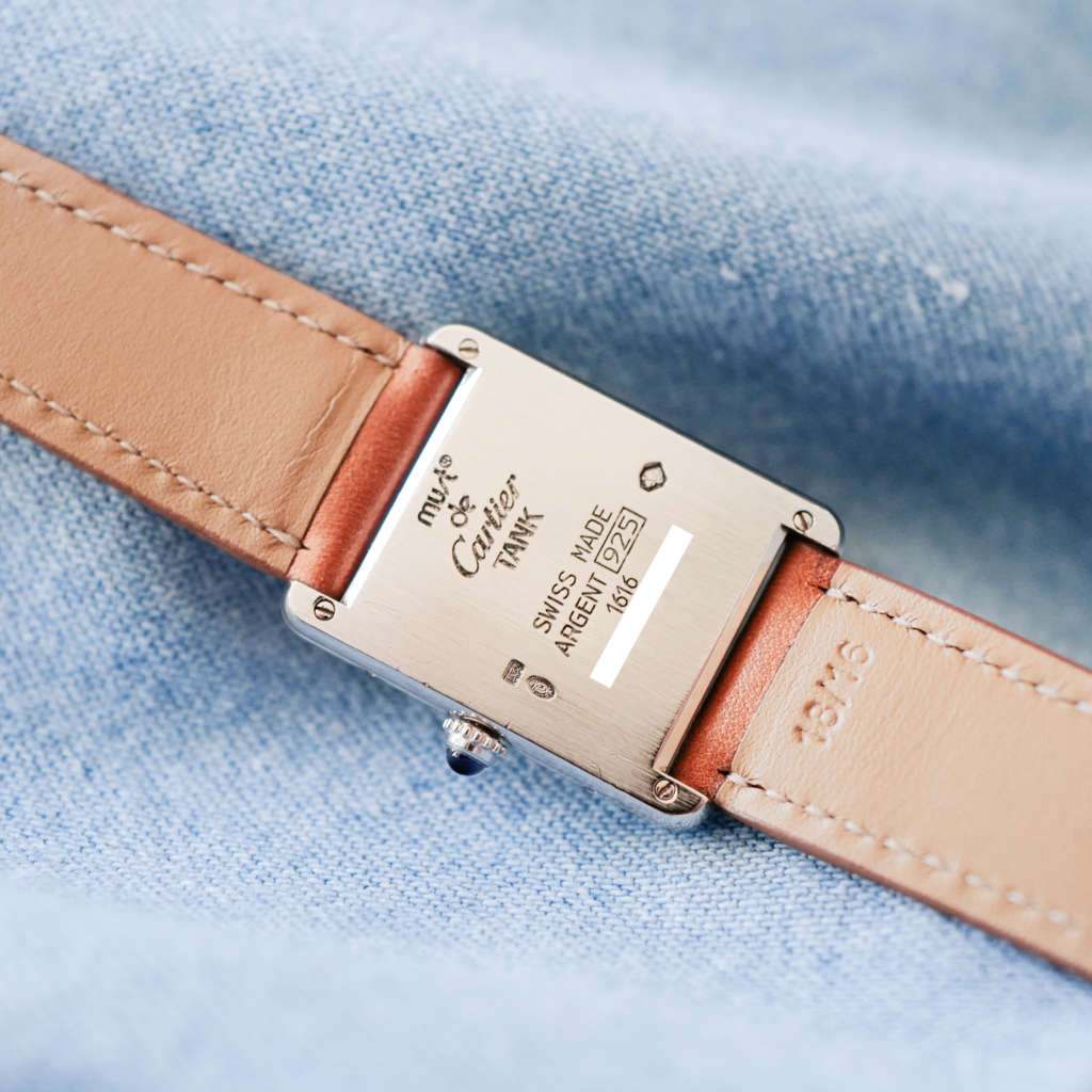 Montre Cartier Tank argent acier bracelet marron vintage