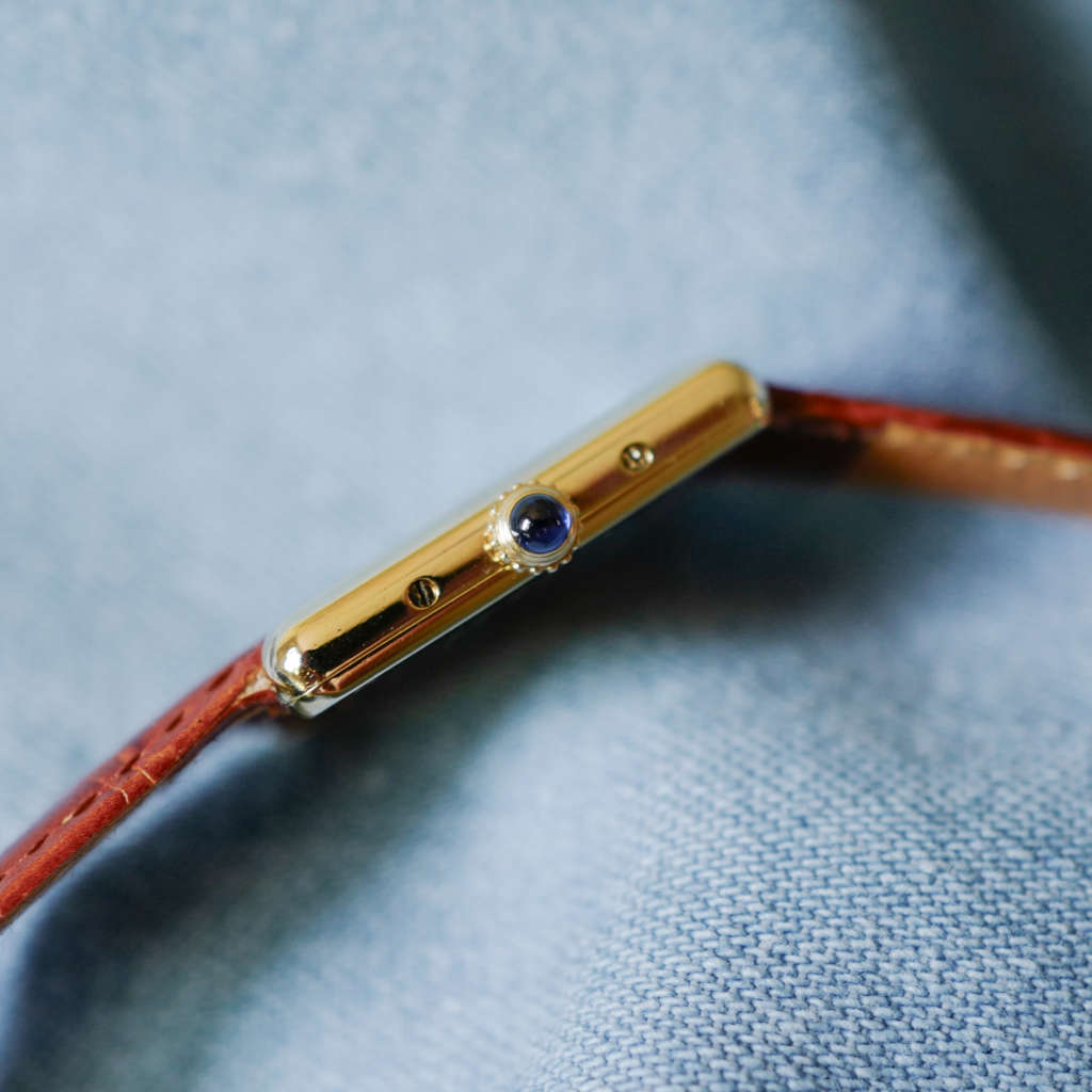 Montre Cartier Tank vintage femme dorée cuir marron