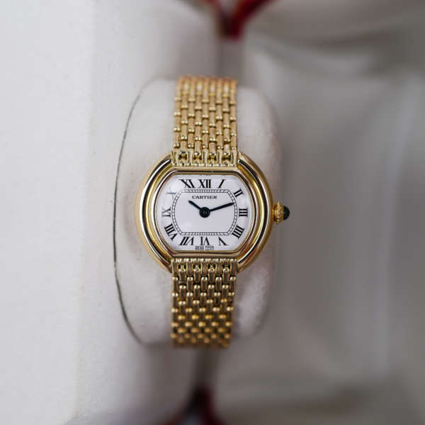 Café Noir Les Montres Marseille Cartier Ellipse femme réf. 67081 bracelet en maille en or jaune 18 carats vintage 1970 investissement