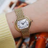 Café Noir Les Montres Marseille Cartier Ellipse femme réf. 67081 bracelet en maille en or jaune 18 carats vintage 1970 investissement