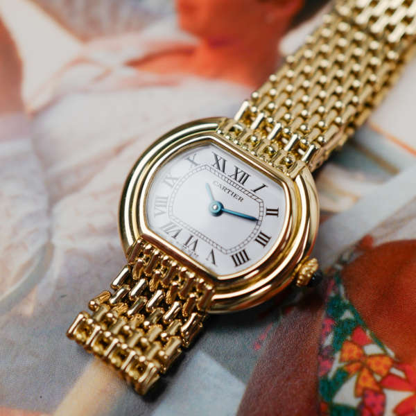 Café Noir Les Montres Marseille Cartier Ellipse femme réf. 67081 bracelet en maille en or jaune 18 carats vintage 1970 investissement