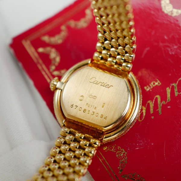 Café Noir Les Montres Marseille Cartier Ellipse femme réf. 67081 bracelet en maille en or jaune 18 carats diamants bracelet serpent commande spéciale vintage 1990