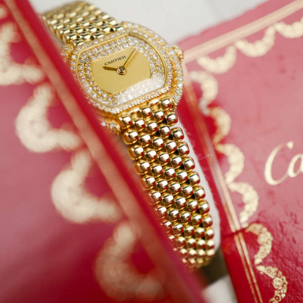Café Noir Les Montres Marseille Cartier Ellipse femme réf. 67081 bracelet en maille en or jaune 18 carats diamants bracelet serpent commande spéciale vintage 1990