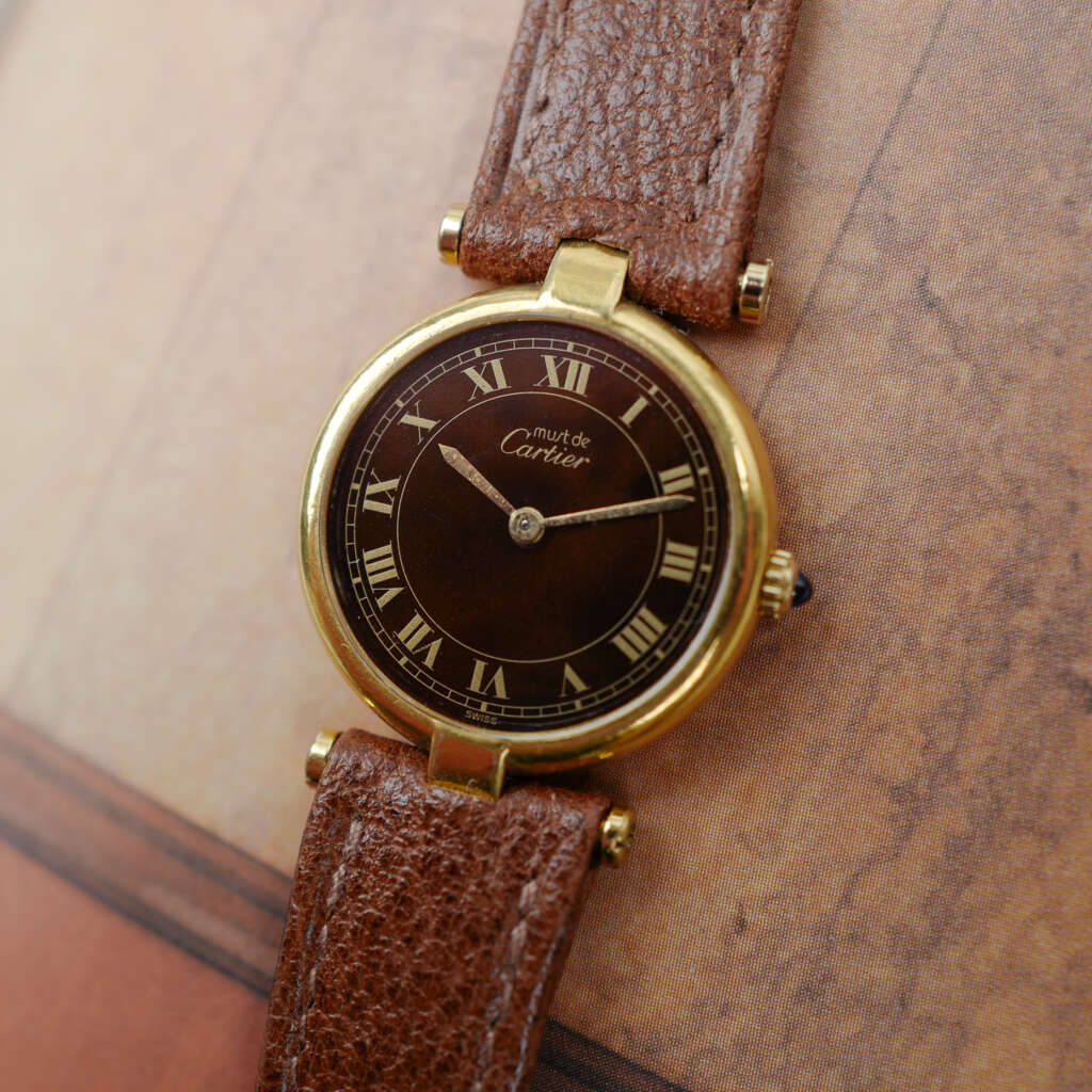cafe noir les montres vintage horloger marseille CARTIER Vendôme Must ronde Grand Modèle Doré vintage petit modèle ronde patine marron_5 cafe noir les montres vintage horloger marseille CARTIER Vendôme Must ronde Grand Modèle Doré vintage petit modèle ronde patine marron