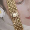 cafe-noir-les-montres-bueche-girod-bijou-manchette-jaune-vintage-1960