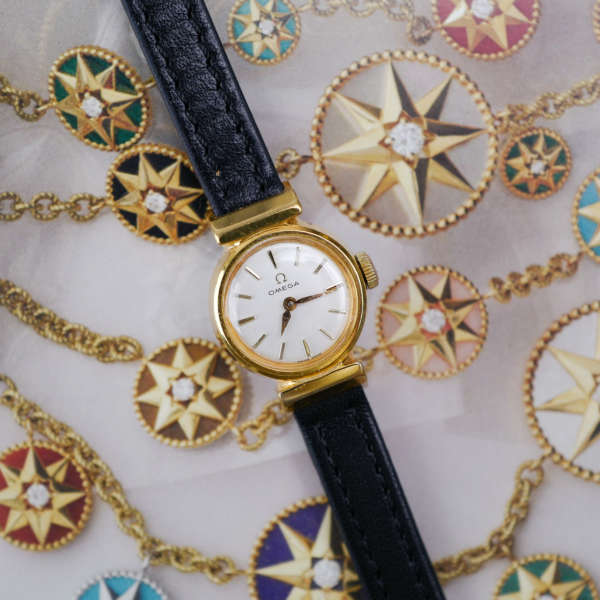 cafe-noir-montres-horloger-marseille-omega-mini-doree-mecanique-1960